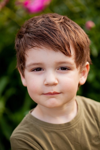 Portrait of a boy outside in natural light the boy staring straight into the camera