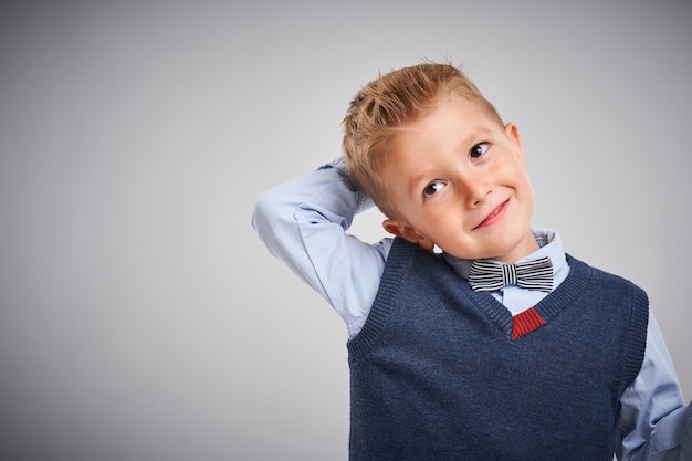 Portrait of a boy posing over white