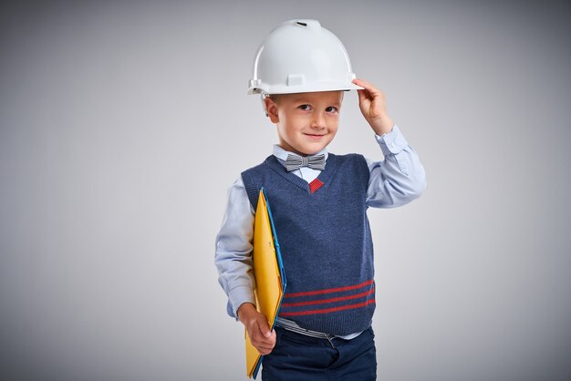 Portrait of a boy posing over white