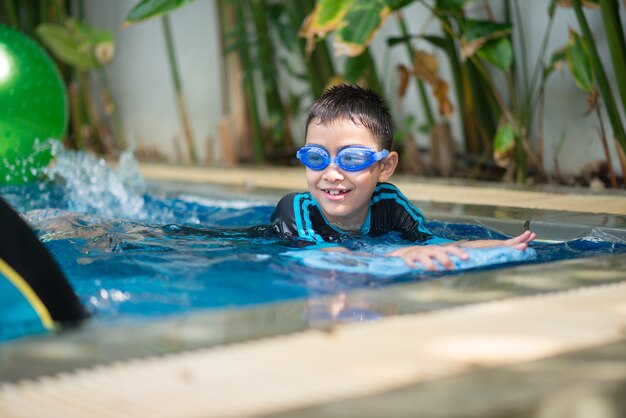 portrait boy swimming in the pool