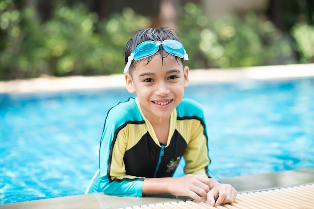 portrait boy swimming in the pool