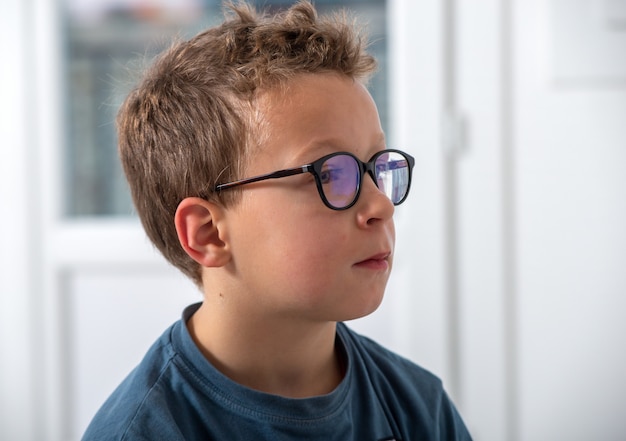 Portrait of a boy with glasses