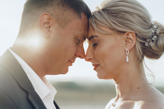 Portrait of a bride and groom in a sunset light