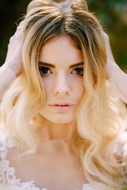 Portrait of the bride in a white dress and veil closeup