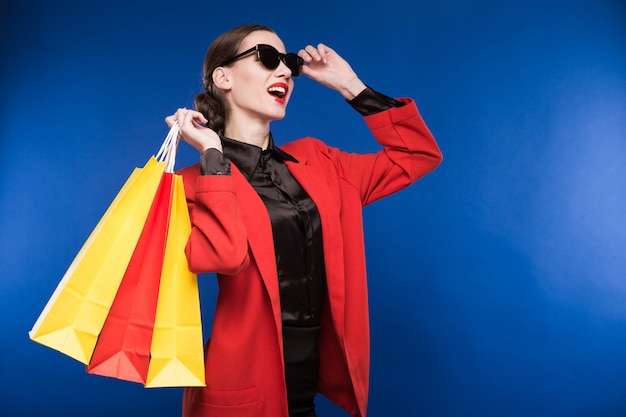 Portrait of the brunette in glasses with bags