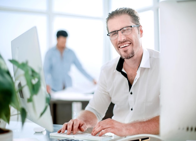 Portrait of business man on blurred office background