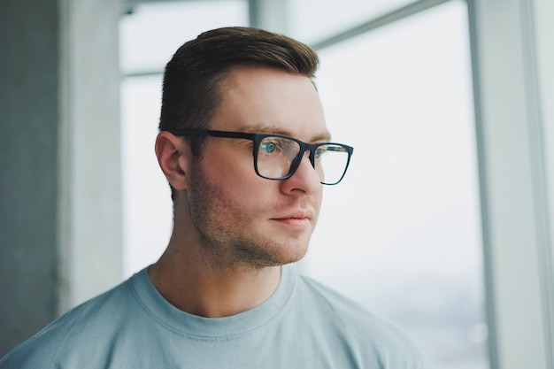 Portrait of a business man in glasses The face of a modern freelancer Businessman in casual clothes