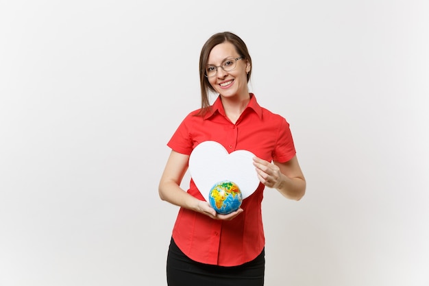 Portrait of business teacher woman in red shirt holding white heart, Earth globe isolated on white background. Problem of environmental pollution. Stop nature garbage, environment protection concept.