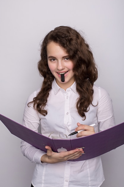 Portrait of a business woman holding folder , Isolated on white background