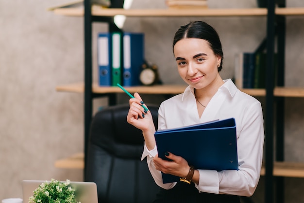 Portrait of business woman in office.