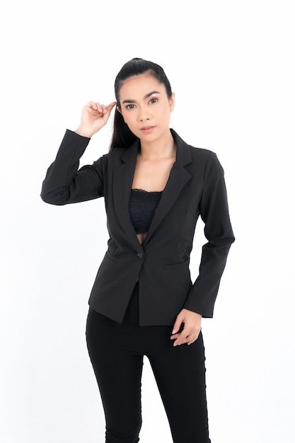 Portrait business woman wearing a black suit at studio shot isolated on white background. Pretty female model. Confident professional office worker.