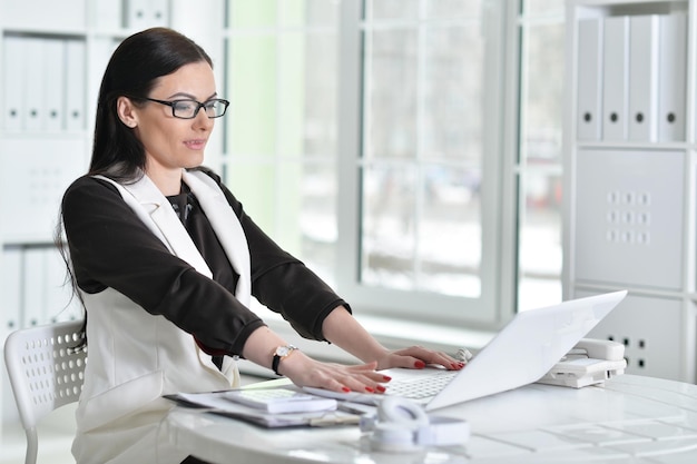 Portrait of a business woman with a laptop