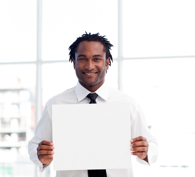 Portrait of an businessman holding a white card