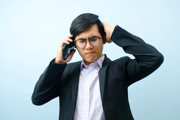 Portrait of businessman talking on phone