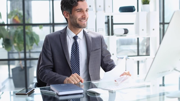 Portrait of businessman video conferencing in an office