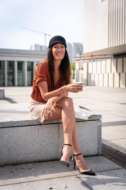 Portrait of a businesswoman outside the office with a take away coffee