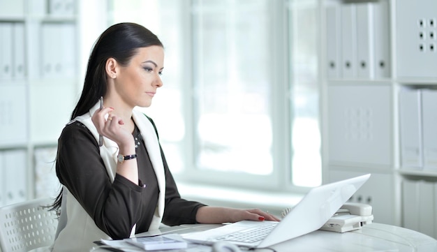 Portrait of businesswoman working in office