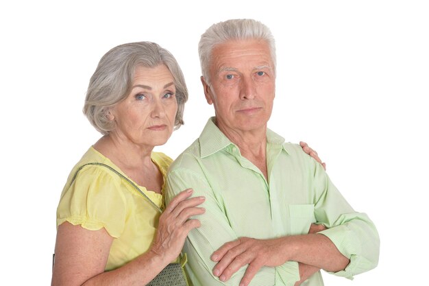 Portrait of calm senior couple on white background