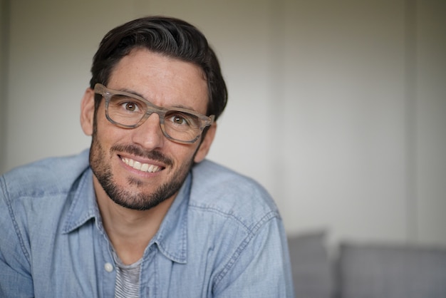 Portrait of casual handsome man wearing designer glasses