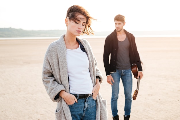 Portrait of a casual young couple on a date at the beach