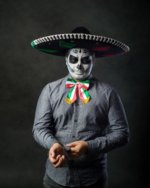 Portrait of a catrin wearing a charro hat Typical Mexican character Day of the dead make up