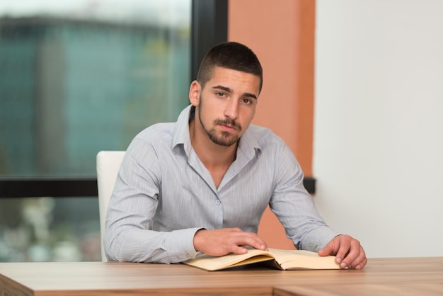 A Portrait Of An Caucasian College Student Man In Library  Shallow Depth Of Field