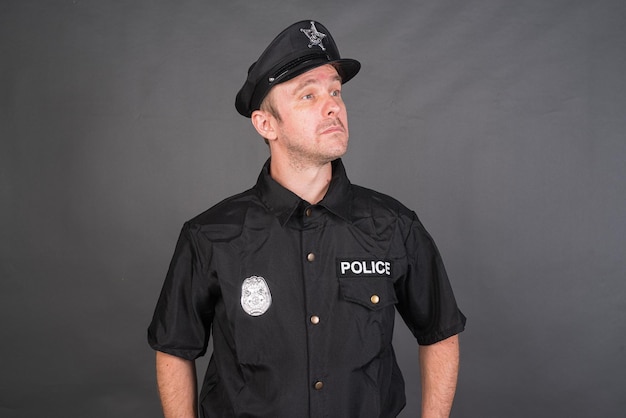 Portrait of Caucasian man wearing police uniform costume