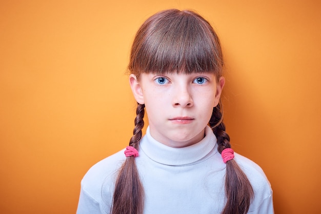 Portrait of caucasian teenage girl with two pigtails