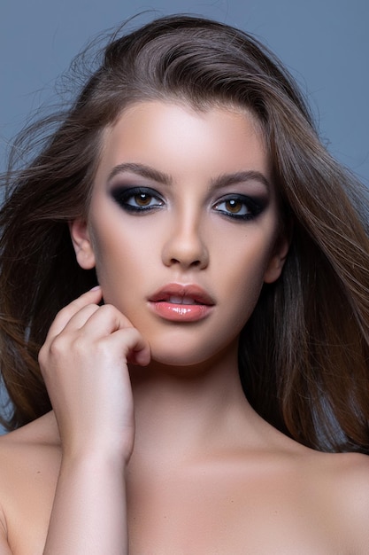 Portrait of a Caucasian young female with smokey eyes