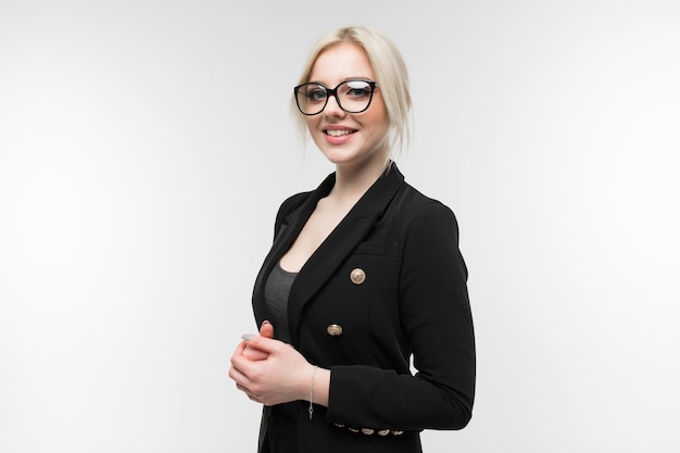 Portrait of charming blonde in black costume possing in glasses   