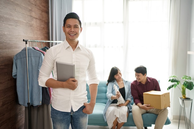 A portrait of a cheerful couple choosing and buying clothes