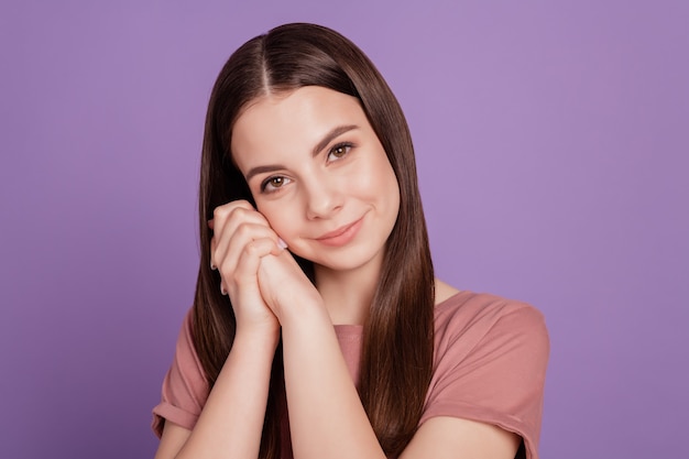 Portrait of cheerful girl feel grateful fists isolated over violet background