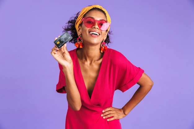 Portrait of a cheerful young african woman in headband