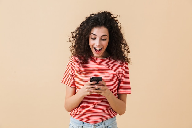 Portrait of a cheerful young woman with curly hair