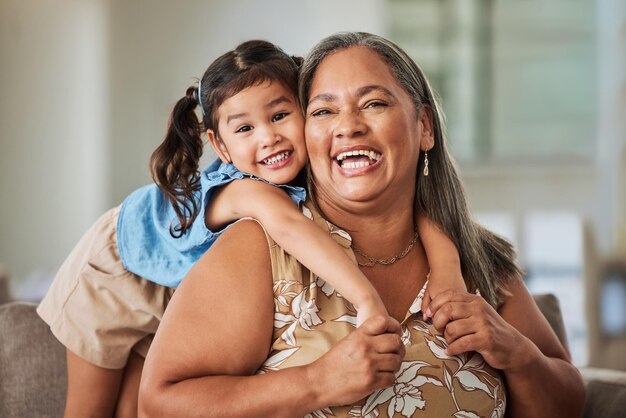 Portrait child and happy grandma love family bonding moments memories and having fun in the house Smile happiness and proud grandmother enjoys quality time and relaxing on a weekend in Jerusalem