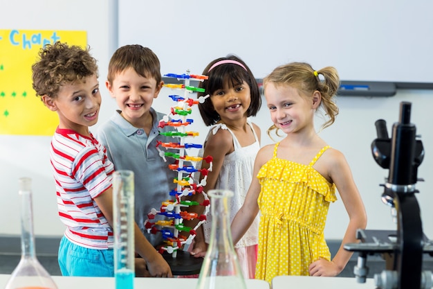 Portrait of children with scientific equipment