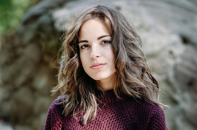 Portrait close up of young beautiful woman outdoors