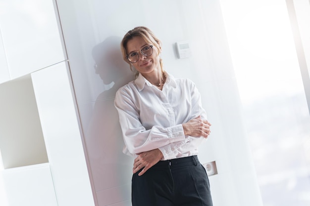 Portrait of confident beautiful business woman working in modern IT office