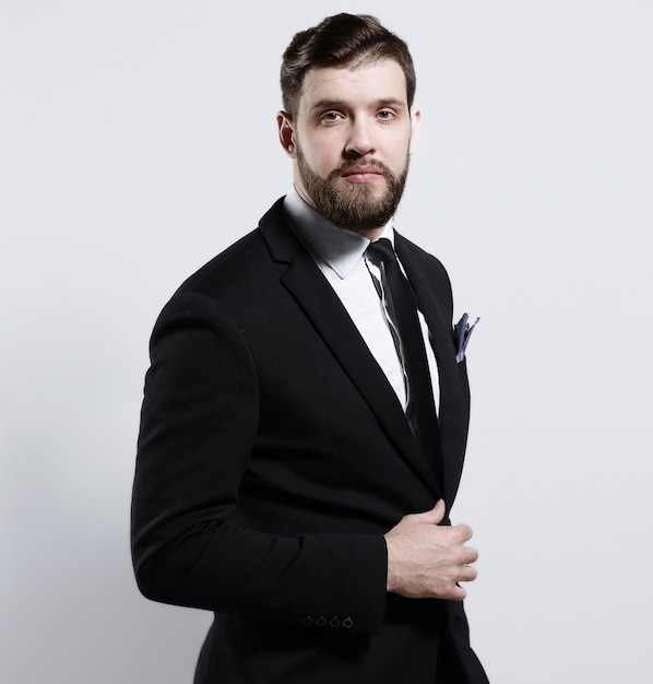 Portrait of a confident businessman.isolated on grey background.