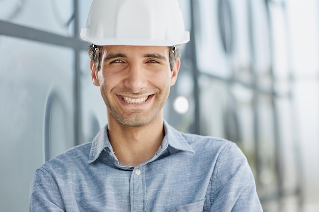 Portrait of a confident businessman in a protective helmet