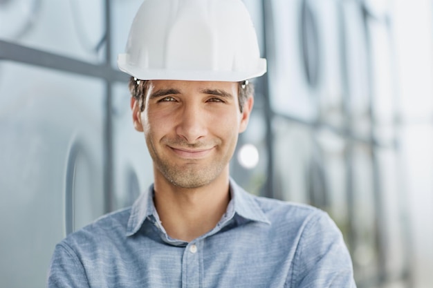 Portrait of a confident businessman in a protective helmet