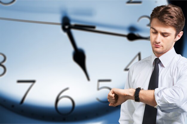 Photo portrait of confident businessman  with clock