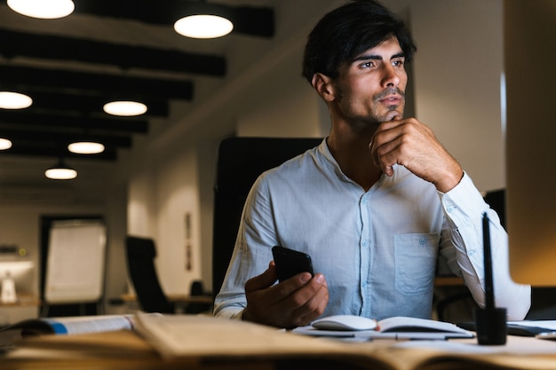 Portrait of a confident concentrated businessman working