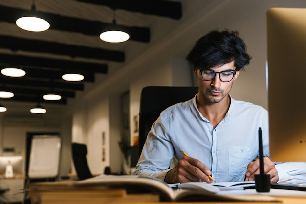 Portrait of a confident concentrated businessman working