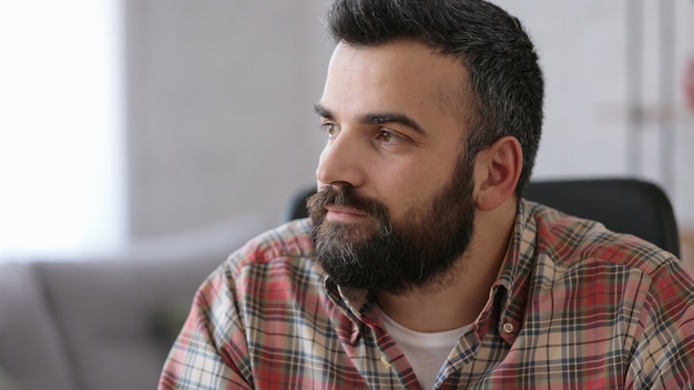 Portrait of confident handsome bearded man. Beautiful human face.