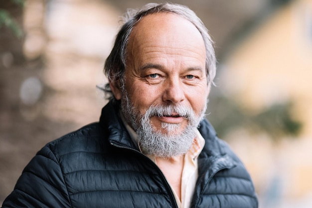 Portrait of a confident handsome mature man looking at the camera senior