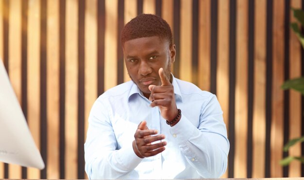 Portrait of a confident senior man businessman accountant manager sitting in the office at the table