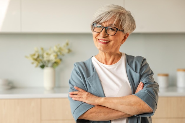 Portrait of confident stylish european middle aged senior woman older mature s lady smiling at home