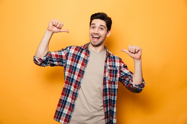 Portrait of a confident young man pointing fingers