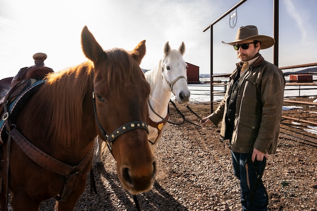 Portrait of cowboy with horses